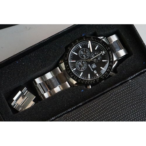 311 - A collection of gents and ladies fashion watches all within original boxes to include Casio and Gues... 