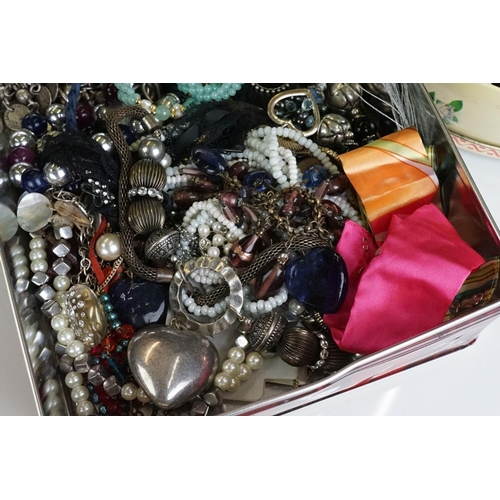 312 - Three tins / tubs of costume jewellery, to include necklaces, bangles, earrings etc