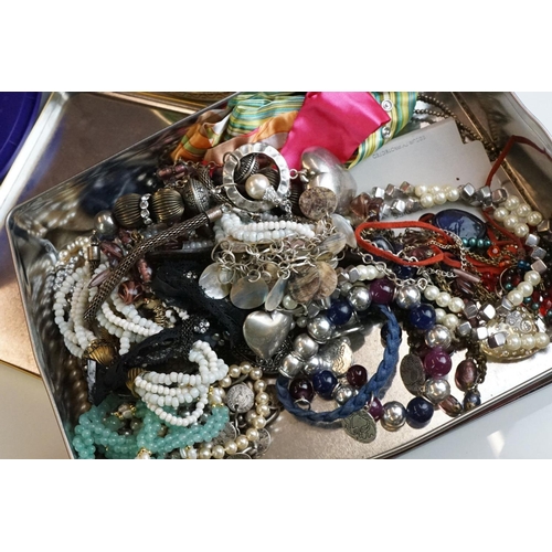 312 - Three tins / tubs of costume jewellery, to include necklaces, bangles, earrings etc