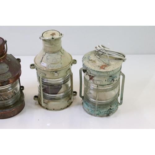 331 - A collection of four ships lanterns to include two copper examples all marked Tung Woo Hong Kong.