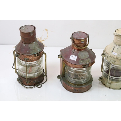 331 - A collection of four ships lanterns to include two copper examples all marked Tung Woo Hong Kong.