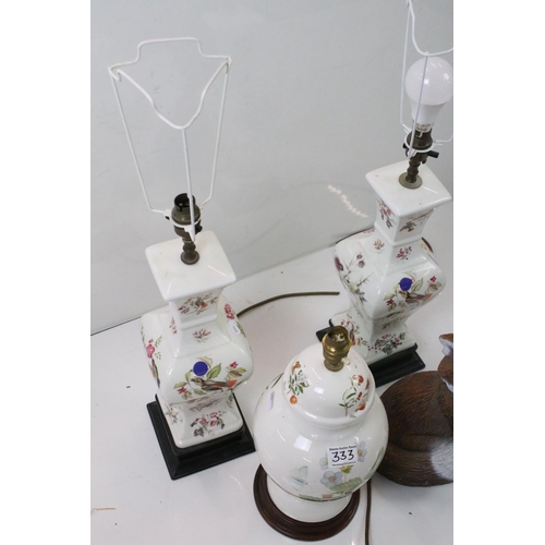 333 - Three ceramic lamp bases with floral and bird decoration together with a outdoor fox ornament.