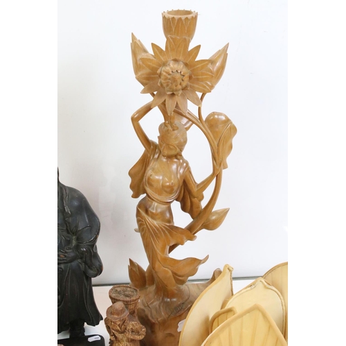 347 - A collection of oriental carved wooden figures together with a lampshade in the form of a lily.