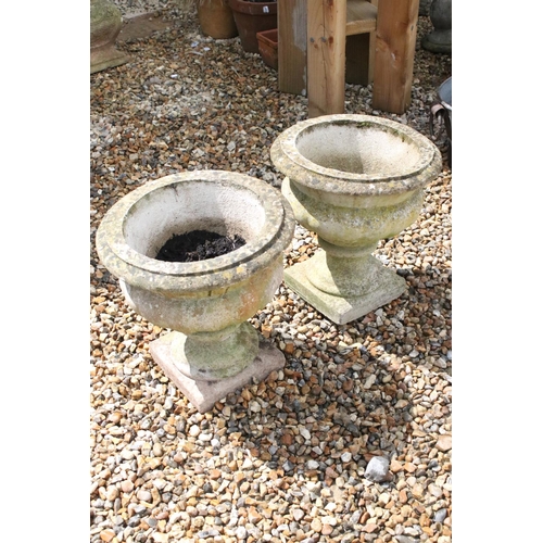 526 - Pair of Garden Reconstituted Stone Urns on pedestal bases, 45cm high