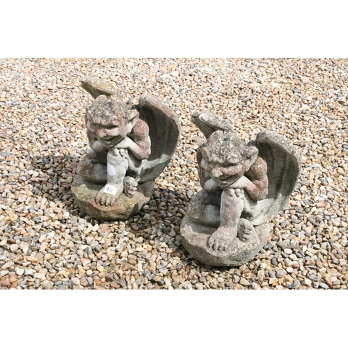 535 - Pair of Garden reconstituted stone gargoyles, 43cm high