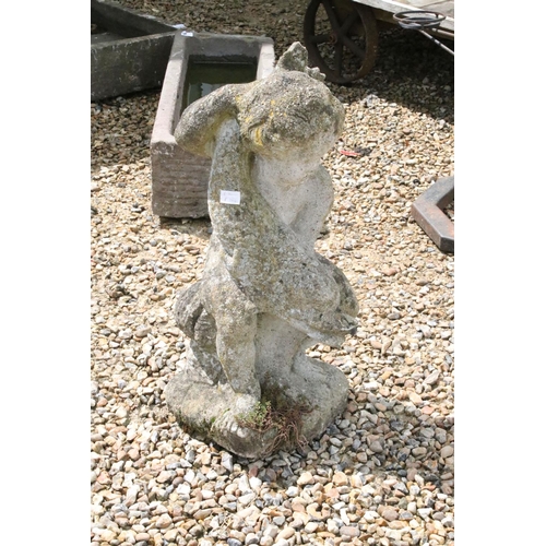 537 - Reconstituted stone Garden figure of Putti holding Fish, 73cm high