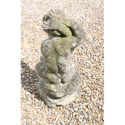 537 - Reconstituted stone Garden figure of Putti holding Fish, 73cm high