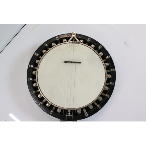 403 - A vintage five string banjo in original fitted case.