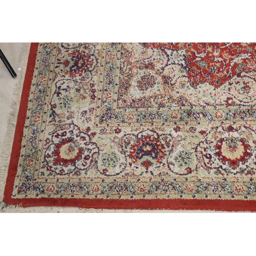 576 - Red Ground Rug with Perisan style design, approximately 236cm x 168cm