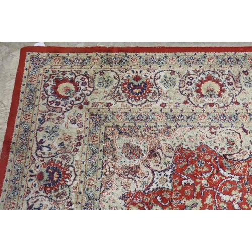 576 - Red Ground Rug with Perisan style design, approximately 236cm x 168cm