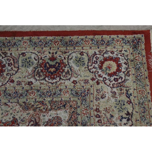 576 - Red Ground Rug with Perisan style design, approximately 236cm x 168cm