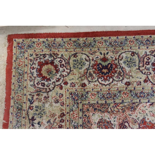 576 - Red Ground Rug with Perisan style design, approximately 236cm x 168cm