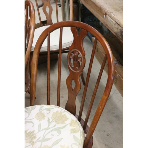 607 - Set of Six Ercol Elm and Beach Dining Chairs with Fleur de Lys Hoop Backs and seat pads together wit... 