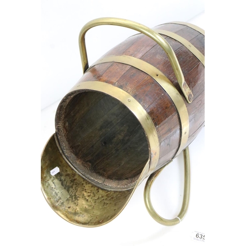 635 - Oak Coopered Barrel and Brass Bound Ale Jug with brass handle and stand, 59cm long x 43cm high