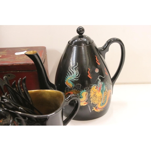 345 - A group of oriental collectables to include tea set, wall plaque, tea caddy and ornamental junk boat... 