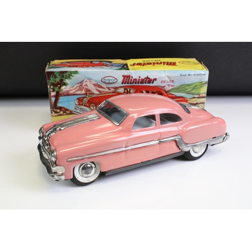 1298 - Two boxed Minister Delux friction powered model cars to include pink (excellent condition) & red (pl... 