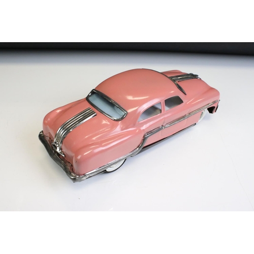 1298 - Two boxed Minister Delux friction powered model cars to include pink (excellent condition) & red (pl... 