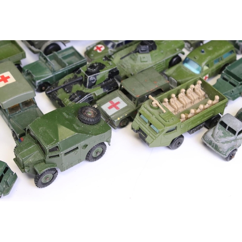 1306 - 55 Mid 20th C onwards play worn military-related diecast models to include Dinky, Britains, Solido, ... 