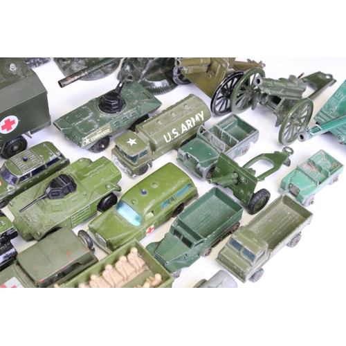 1306 - 55 Mid 20th C onwards play worn military-related diecast models to include Dinky, Britains, Solido, ... 