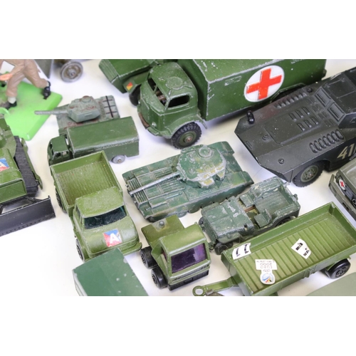 1306 - 55 Mid 20th C onwards play worn military-related diecast models to include Dinky, Britains, Solido, ... 