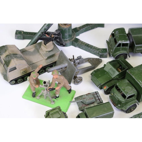 1306 - 55 Mid 20th C onwards play worn military-related diecast models to include Dinky, Britains, Solido, ... 