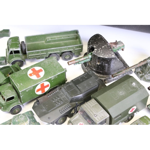 1306 - 55 Mid 20th C onwards play worn military-related diecast models to include Dinky, Britains, Solido, ... 