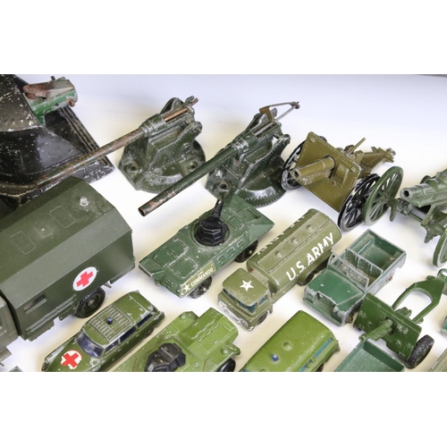 1306 - 55 Mid 20th C onwards play worn military-related diecast models to include Dinky, Britains, Solido, ... 