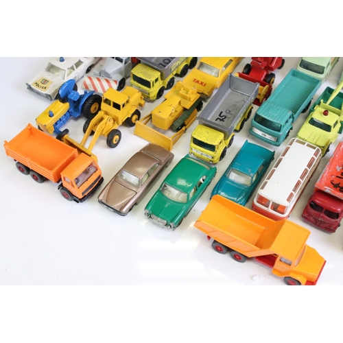 1309 - Around 35 mid 20th C diecast models to include mainly Matchbox 75 Series examples, features commerci... 