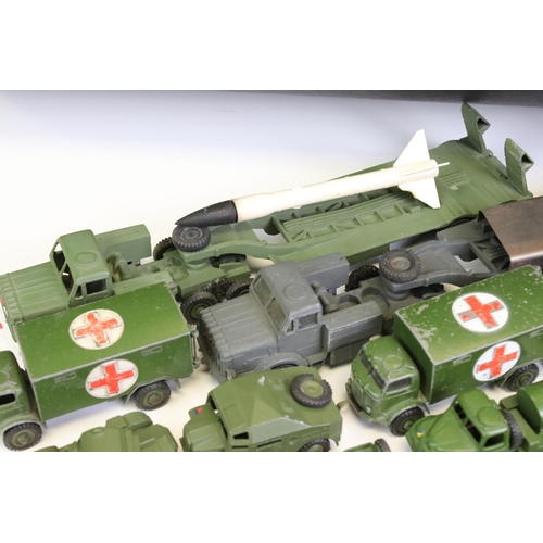 1347 - Over 25 Dinky mid 20th C military diecast models to include Supertoys 660 Tank Transporter, 688 Fiel... 