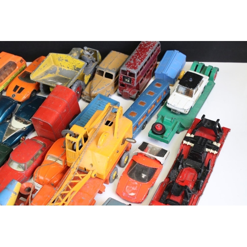 1338 - Around 40 mostly mid 20th C play worn diecast models, to include Dinky and Corgi, featuring Corgi ER... 