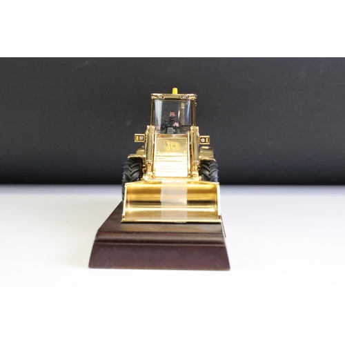 1225 - Boxed JCB 414S Farm Master diecast model finished in gold plate, diecast shows light surface scratch... 