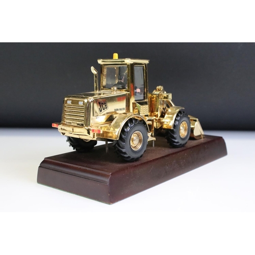 1225 - Boxed JCB 414S Farm Master diecast model finished in gold plate, diecast shows light surface scratch... 