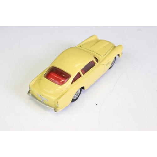 1386A - Boxed Corgi 218 Aston Martin DB4 diecast model in yellow with red interior, diecast vg with some gru... 