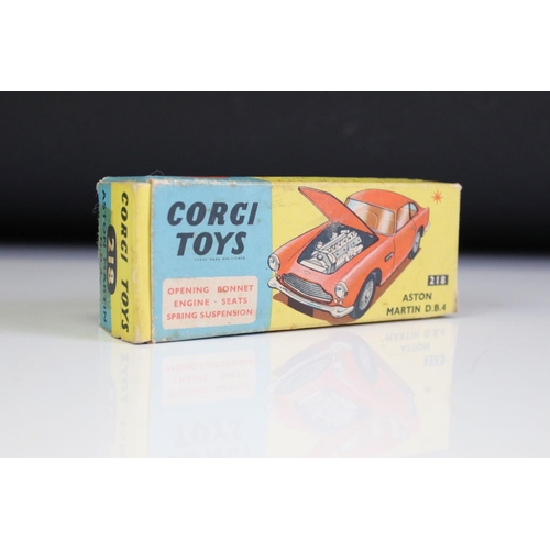 1386A - Boxed Corgi 218 Aston Martin DB4 diecast model in yellow with red interior, diecast vg with some gru... 