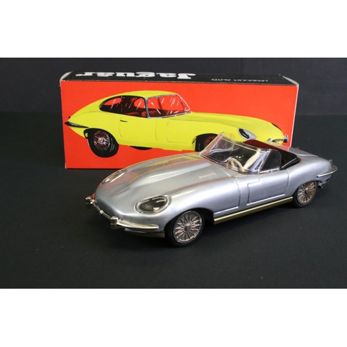 236 - Four boxed tin plate friction powered models to include Standard Sedan in white with pink hood, Leme... 