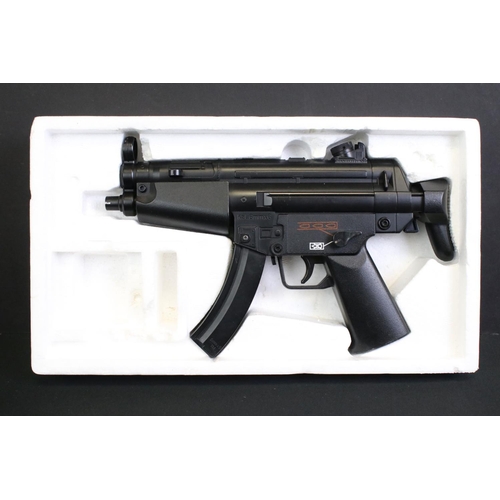 244 - Three plastic toy BB guns to include a boxed Super UHC MMP5 A5 Mini Machine Gun