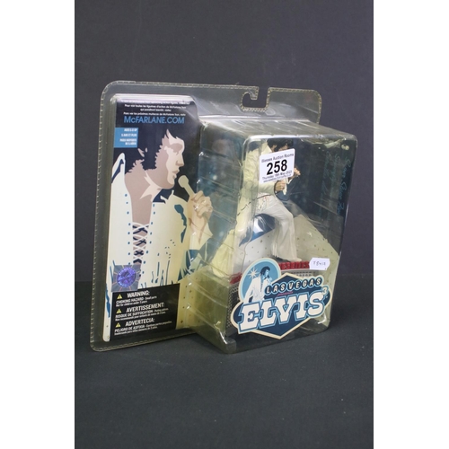 258 - Three boxed McFarlane Elvis Presley figures to include Las Vegas Elvis, Aloha Elvis and 1956 The Yea... 