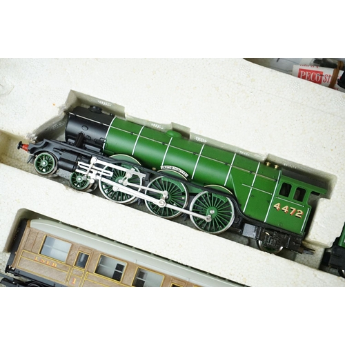 63 - Two boxed Hornby OO gauge train sets to include R726 The Railfreight and R1001 Flying Scotsman, both... 