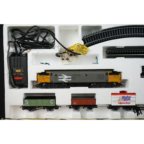 63 - Two boxed Hornby OO gauge train sets to include R726 The Railfreight and R1001 Flying Scotsman, both... 