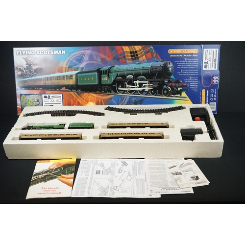 63 - Two boxed Hornby OO gauge train sets to include R726 The Railfreight and R1001 Flying Scotsman, both... 