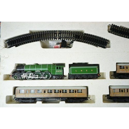 63 - Two boxed Hornby OO gauge train sets to include R726 The Railfreight and R1001 Flying Scotsman, both... 