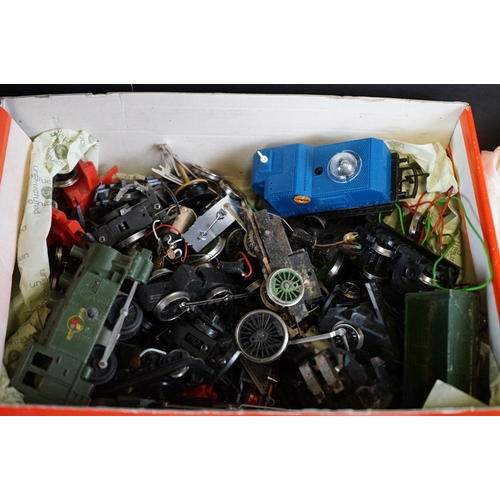 105 - Quantity of OO gauge model railway accessories to include engine bodies, various spares & repairs, t... 