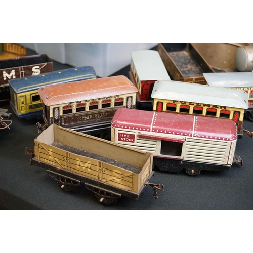 130 - Quantity of O gauge model to include around 36 x items of rolling stock, platform building with book... 