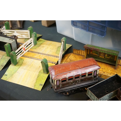 130 - Quantity of O gauge model to include around 36 x items of rolling stock, platform building with book... 