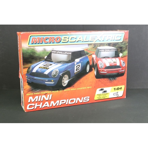 265 - Two Boxed Micro Scalextric 1:64 Mini Champions 'BMW Mini Cooper Blue V BMW Mini Cooper Red' sets, pl... 