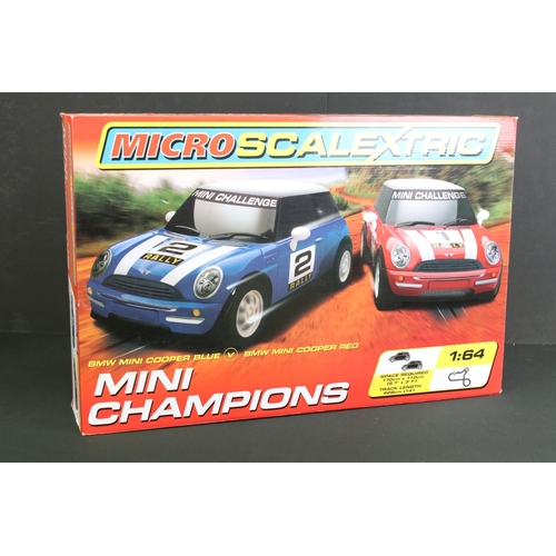 265 - Two Boxed Micro Scalextric 1:64 Mini Champions 'BMW Mini Cooper Blue V BMW Mini Cooper Red' sets, pl... 