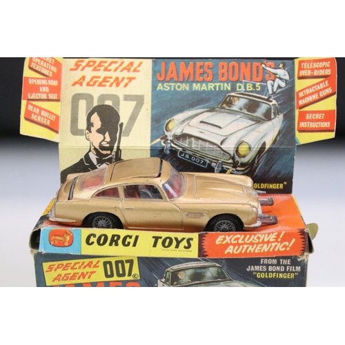 1410 - Boxed Corgi 261 James Bond Aston Martin DB5 diecast model with 2 x ejector figures and secret instru... 