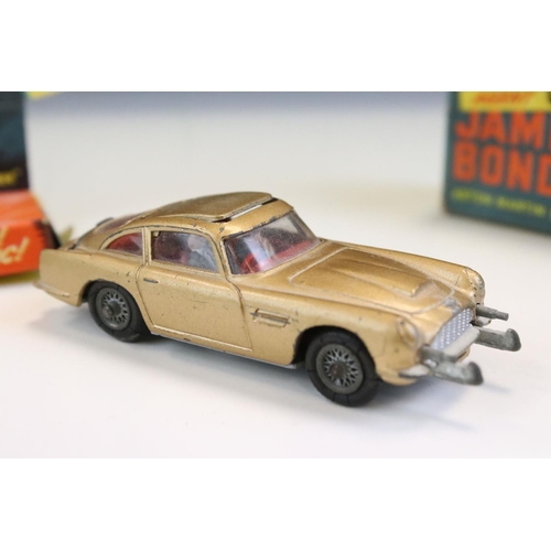 1410 - Boxed Corgi 261 James Bond Aston Martin DB5 diecast model with 2 x ejector figures and secret instru... 