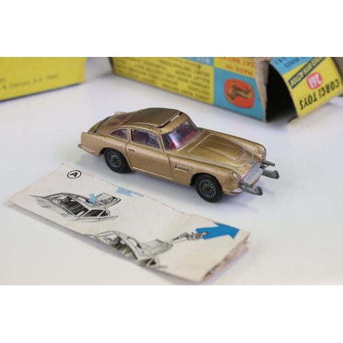 1410 - Boxed Corgi 261 James Bond Aston Martin DB5 diecast model with 2 x ejector figures and secret instru... 