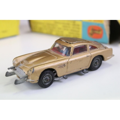 1410 - Boxed Corgi 261 James Bond Aston Martin DB5 diecast model with 2 x ejector figures and secret instru... 